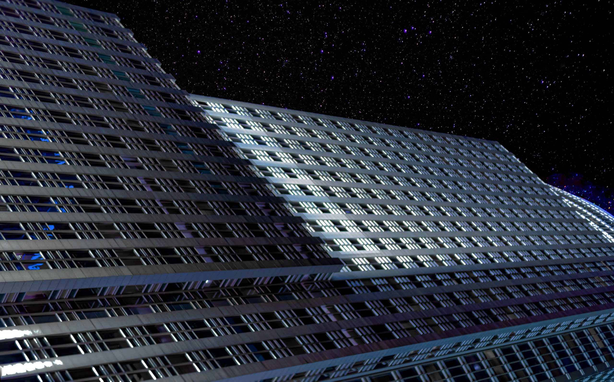 A skyscraper from downtown Omaha Nebraska superimposed and edited into a science fiction setting.